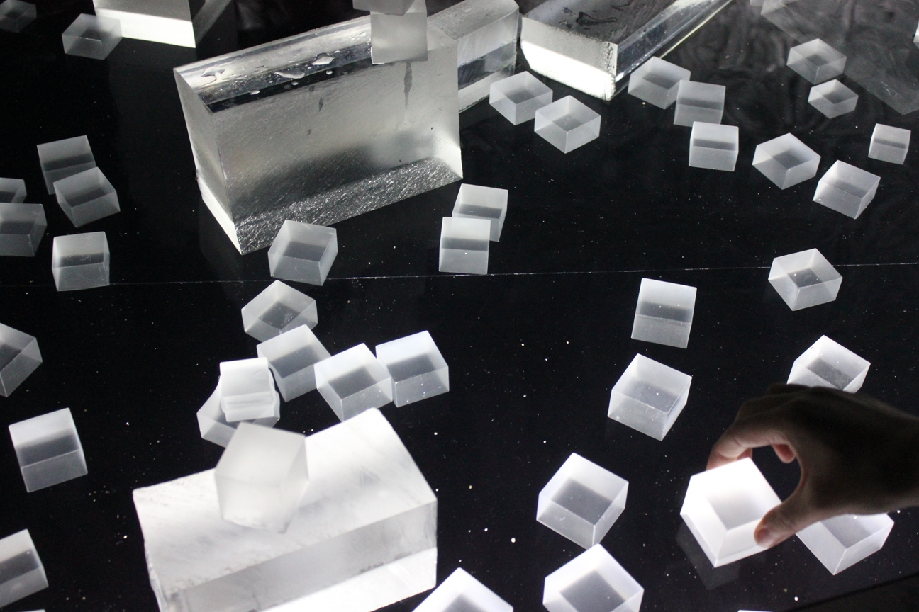 Samsung area: the ice lookalikes are taken by hand and put in the water, sound installation in background